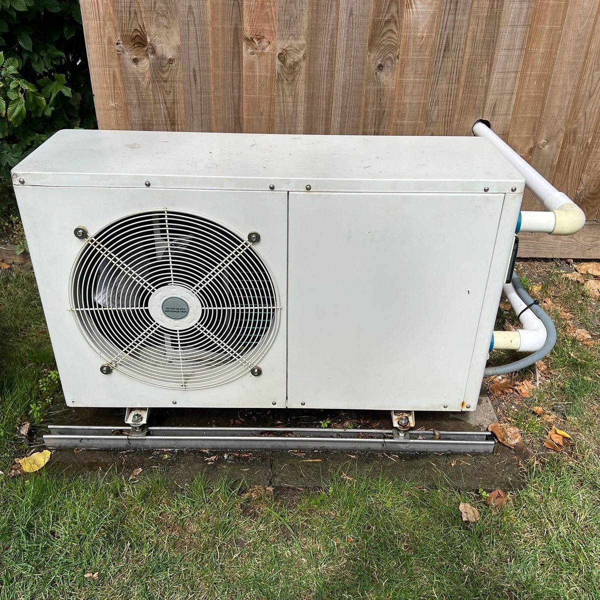 An air source heat pump outdoor unit with insulated flow and return