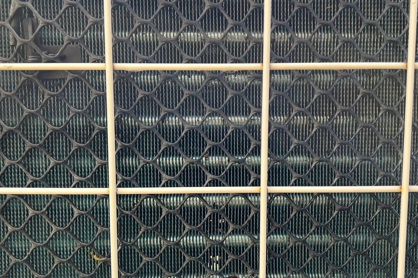 A blocked heat exchanger coil before cleaning